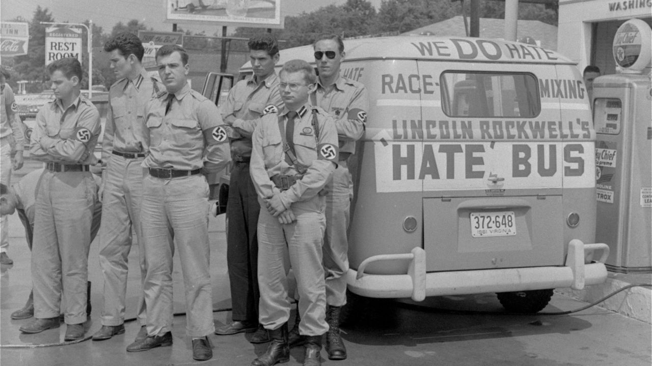 George Lincoln Rockwell, center, leader of the American Nazi Party, with followers and his "hate bus" in  Alabama in 1961.