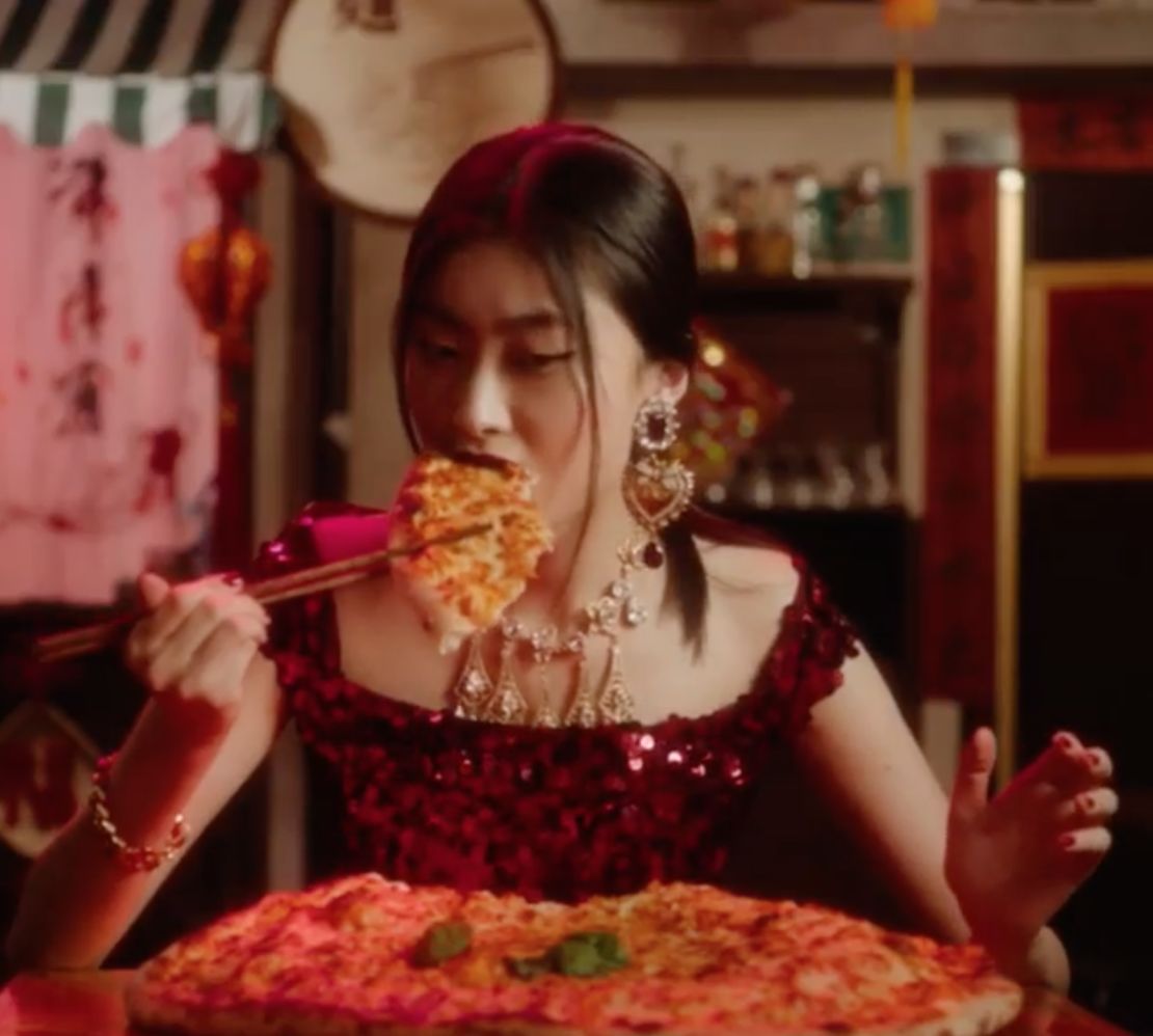 A video ad showing a Chinese woman struggling to eat pizza with chopsticks has unleashed a firestorm for D&G.