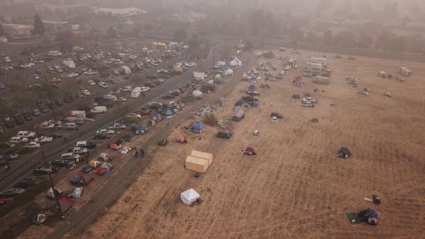 Evacuees from the Camp Fire shelter in tents outside the Walmart in Chico, California.