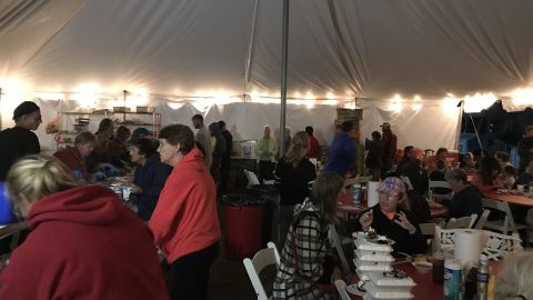An evening at Camp Happy Tummies. They have served hundreds of hot meals a day.