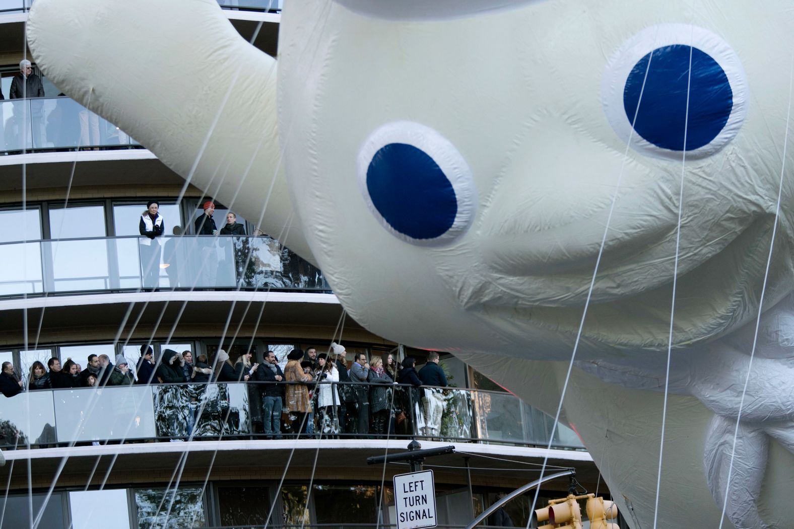 The Pillsbury Doughboy floats across Central Park South.