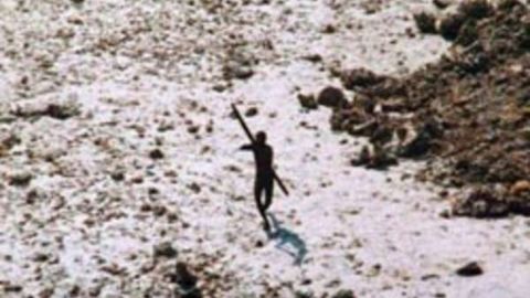 An image of a Sentinelese tribesman aiming a bow and arrow at a helicopter which was assessing the tribe's wellbeing in 2004, following the Indian Ocean tsunami. 