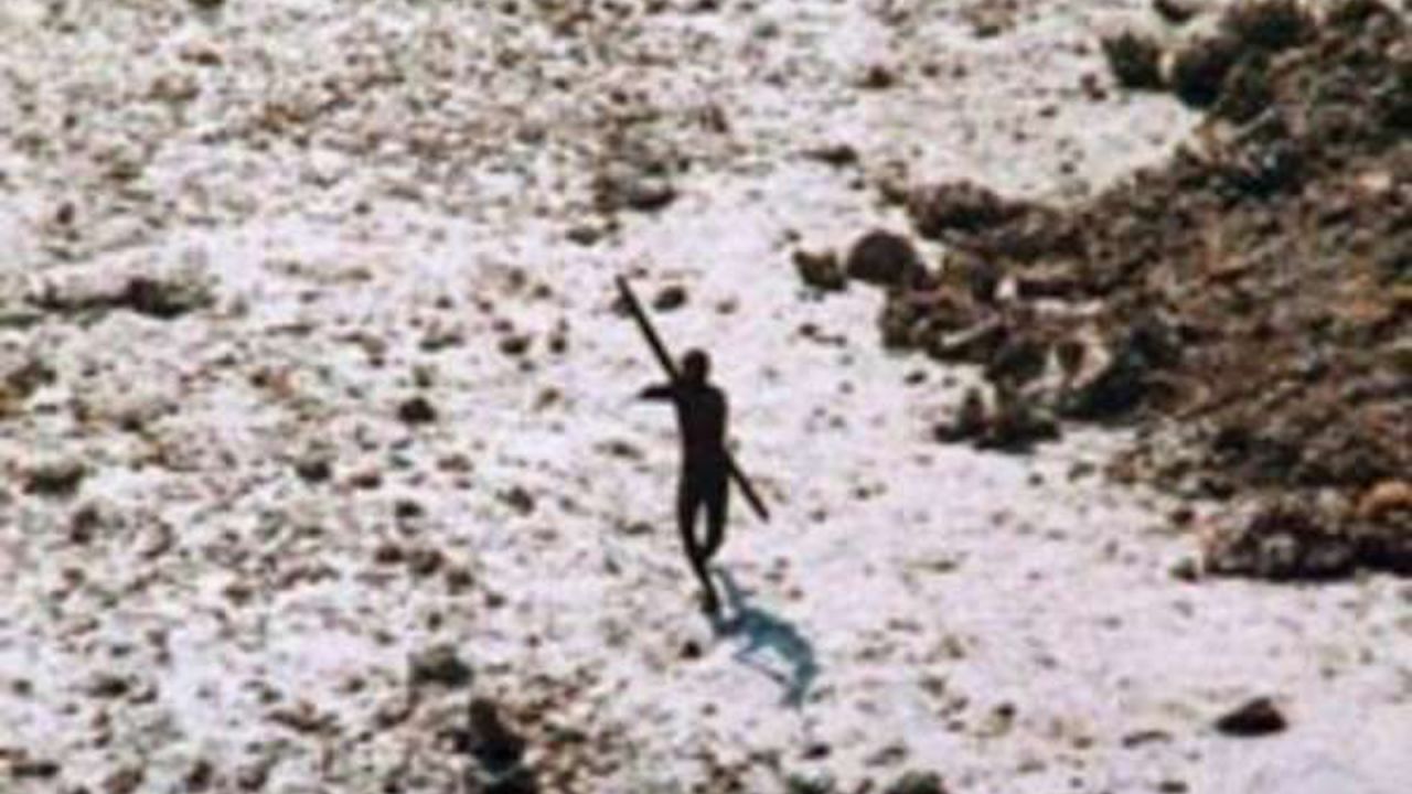 An image of a Sentinelese tribesman aiming a bow and arrow at a helicopter in 2004, following the Indian Ocean tsunami.