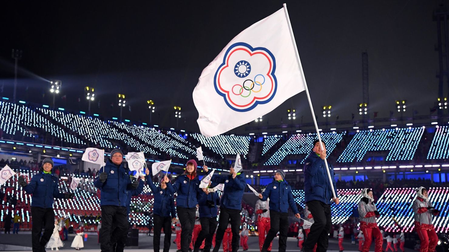 Flag bearer Te-An Lien of Chinese Taipei and teammates enter the stadium during the Opening Ceremony of the PyeongChang 2018 Winter Olympic Games at PyeongChang Olympic Stadium in South Korea. 