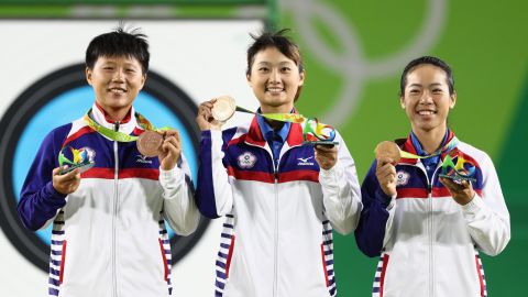 Team Chinese Taipei celebrate with their Bronze medals after finishing third in the Women's Team Finals at the Rio 2016 Olympic Games on August 7, 2016.