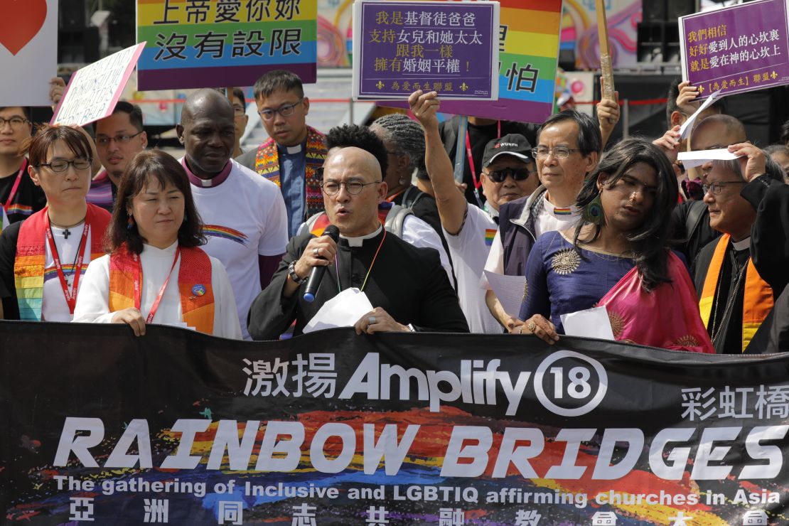 Members of a pro-gay Christian group assemble for the media before the start of a gay pride parade in Taipei on October 27, 2018.