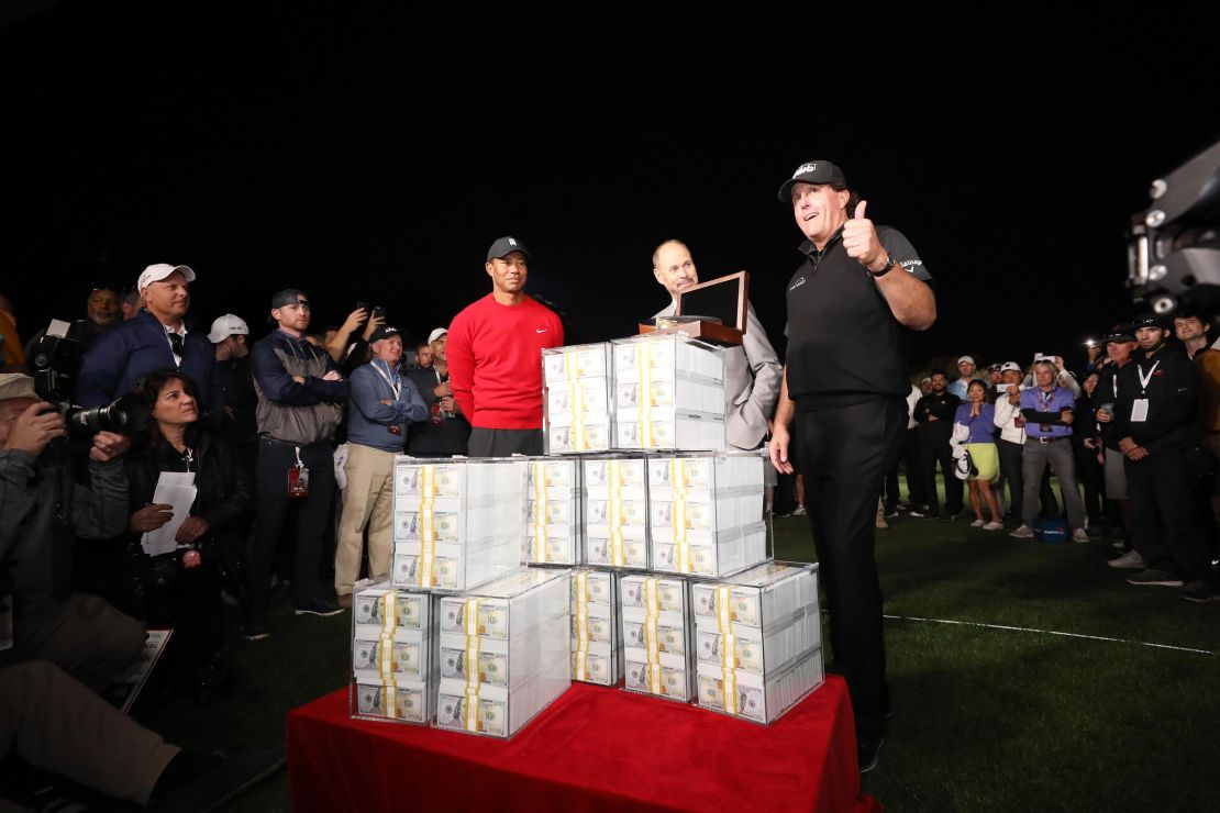 Phil Mickelson celebrates after winning $9M for beating Tiger Woods in 2018.