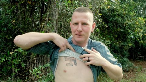 Ken Parker reveals a swastika he had tattooed on his chest when he was involved in the neo-Nazi movement. 