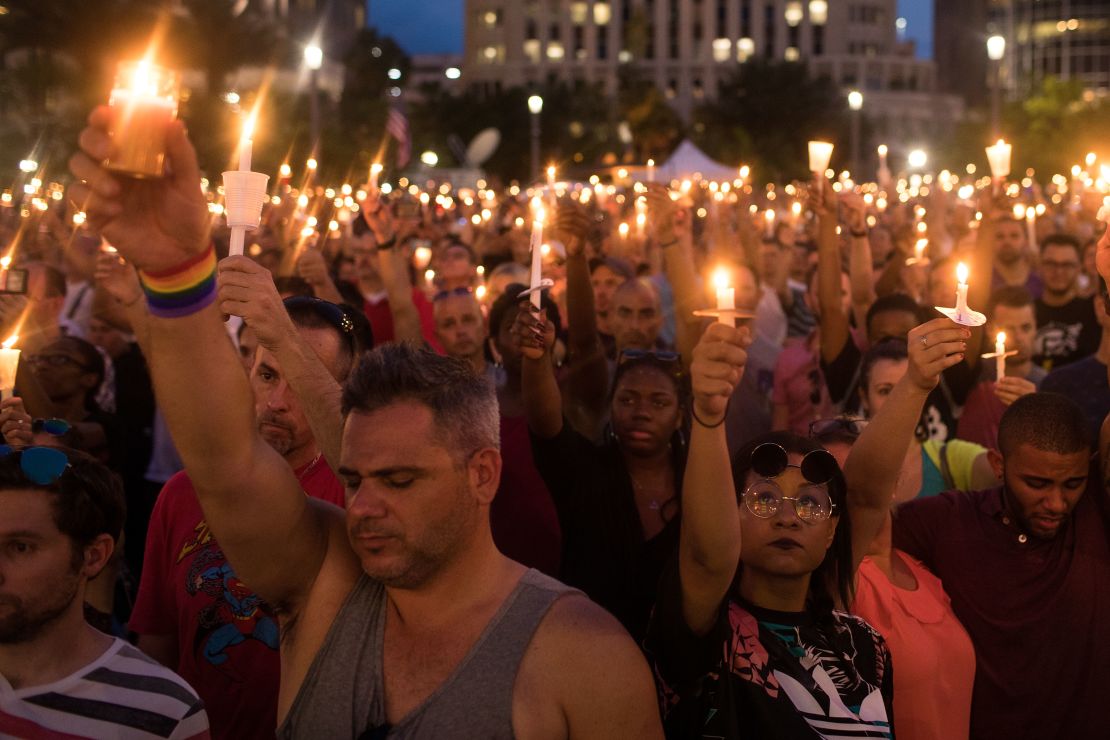 Hundreds of people hold candles at a memorial after the Pulse Nightclub shooting in Orlando, Florida.