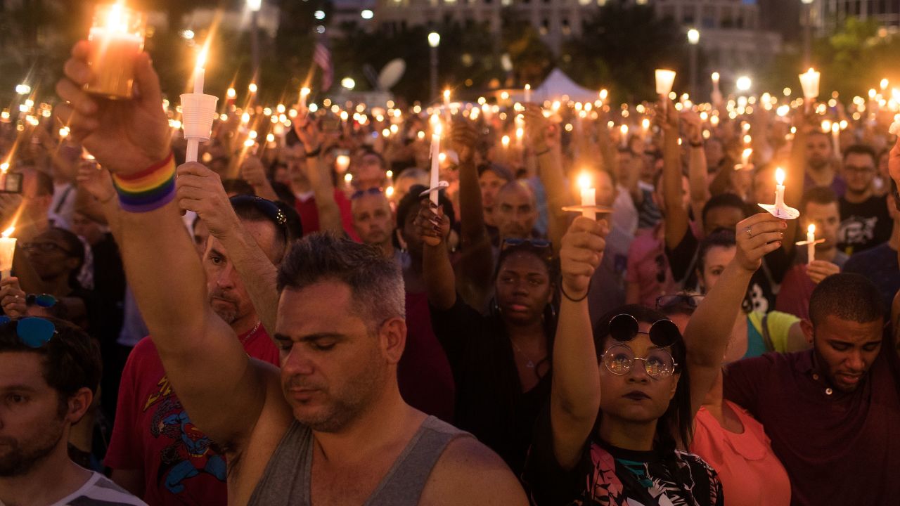 Hundreds of people hold candles at a memorial after the Pulse Nightclub shooting in Orlando, Florida.