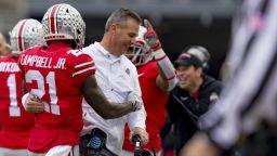 COLUMBUS, OH - NOVEMBER 24: Ohio State Buckeyes head coach Urban Meyer smiles with Ohio State Buckeyes wide receiver Parris Campbell (21) after he scored a touchdown in a game between the Ohio State Buckeyes and the Michigan Wolverines on November 24, 2018 at Ohio Stadium in Columbus, OH. (Photo by Adam Lacy/Icon Sportswire) (Icon Sportswire via AP Images)