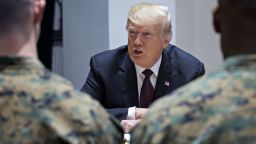 WASHINGTON, DC - NOVEMBER 15: U.S. President Donald Trump talks with Marines while visiting Marine Barracks on November 15, 2018 in Washington, D.C. President Trump and the First Lady are meeting with Marines who responded to a building fire at the Arthur Capper Public Housing complex on September 9, 2018. (Photo by Andrew Harrer-Pool/ Getty Images)