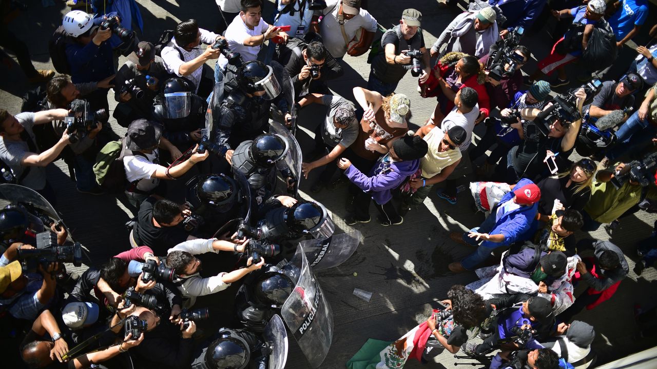 Migrants clash with law enforcement near the US-Mexico border in Tijuana.