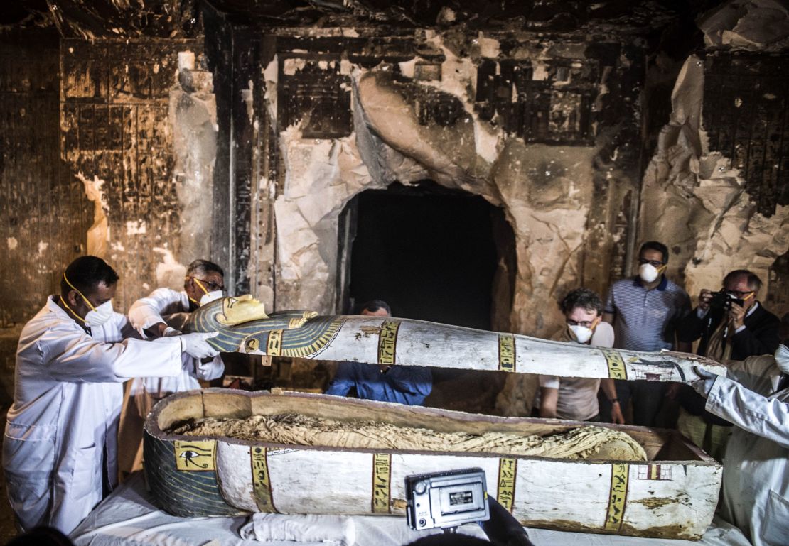 Officials open the sarcophagus in the city of Luxor, southern Egypt.