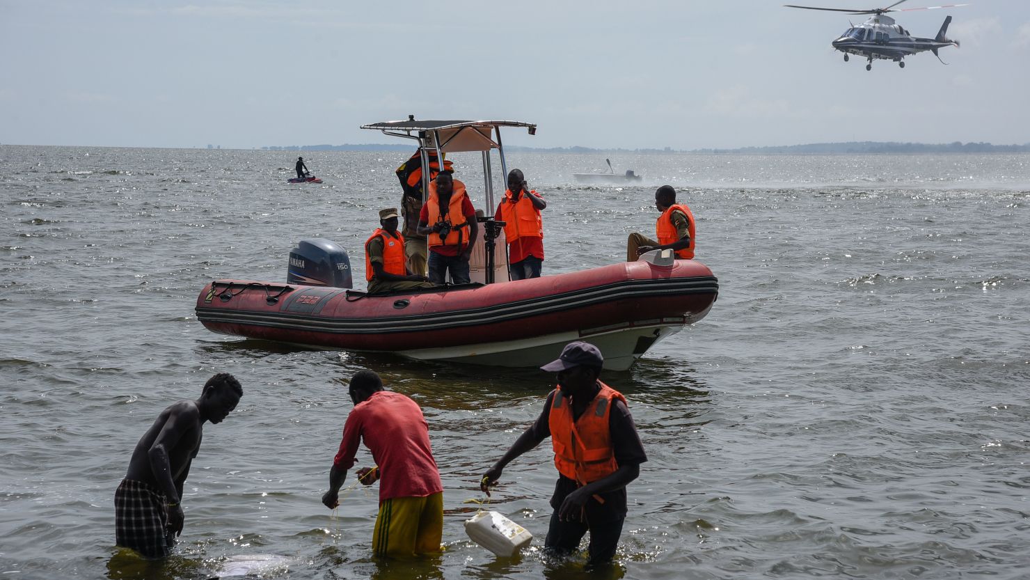 Rescuers search for victims at the site of a capsized cruise boat on Lake Victoria.