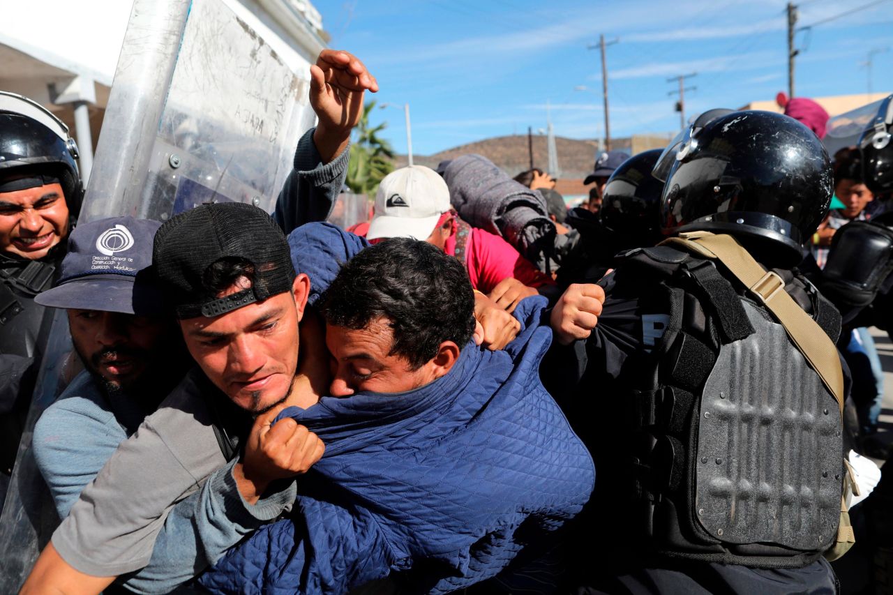 Migrants clash with Mexican police.
