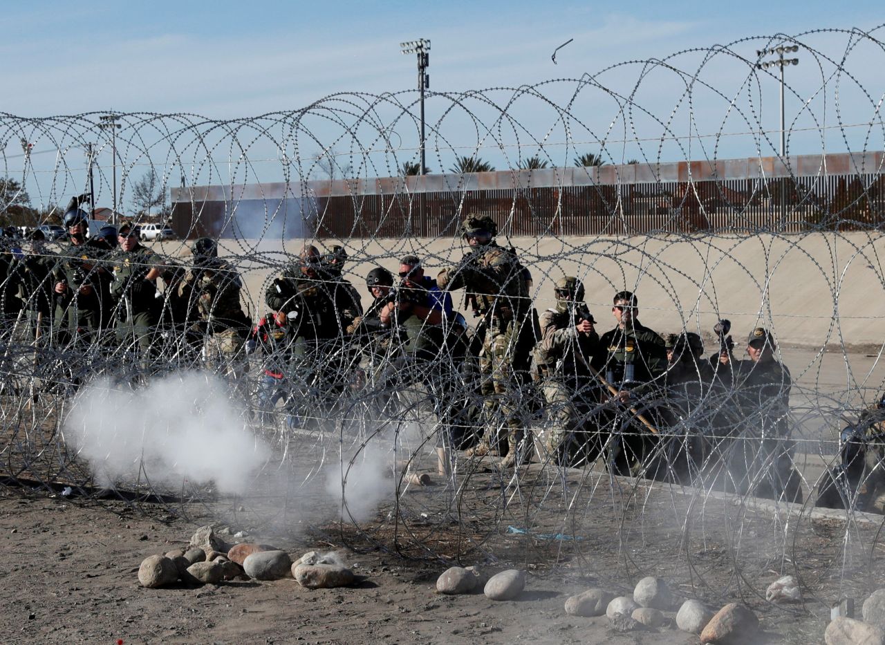 US Border Patrol agents fire tear gas toward migrants at the border.