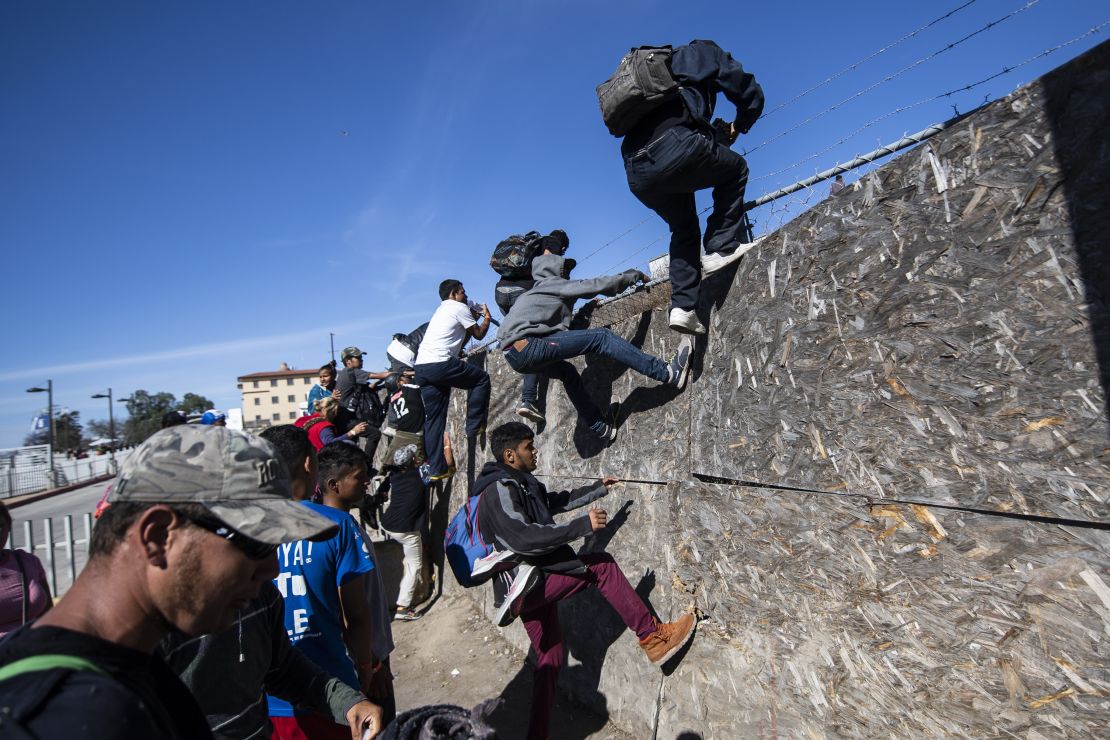 A group of Central American migrants, mostly from Honduras, tried to reach the US-Mexico border near the El Chaparral border crossing in Tijuana on November 25, after US officials temporarily closed the San Ysidro crossing point.