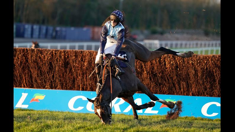 Jockey James Best and his horse, The Kings Writ, fall during the Clarion Defence & Security Handicap Chase Wednesday, November 21 in Chepstow, Wales.