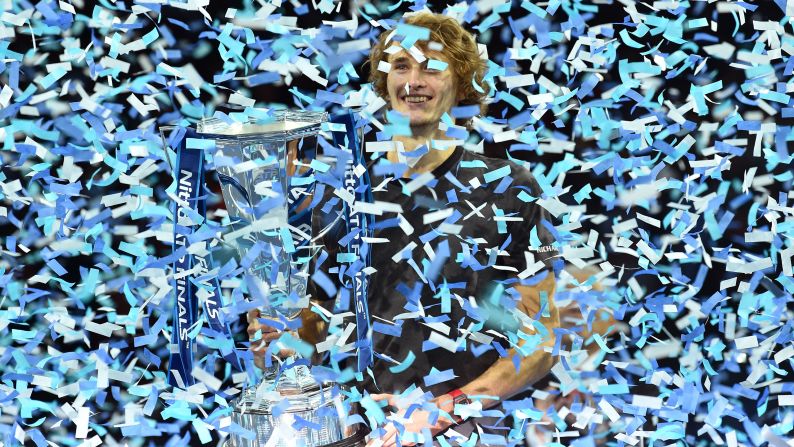 Germany's Alexander Zverev is covered in ticker tape and presented with a trophy after beating Serbia's Novak Djokovic in their men's singles final match at the ATP World Tour Finals tennis tournament in London on Sunday, November 18.