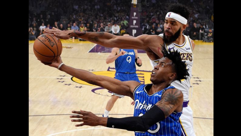 Los Angeles Lakers center JaVale McGee blocks the shot of Orlando Magic forward Wesley Iwundu during the first half of an NBA basketball game on Sunday, November 25 in Los Angeles.