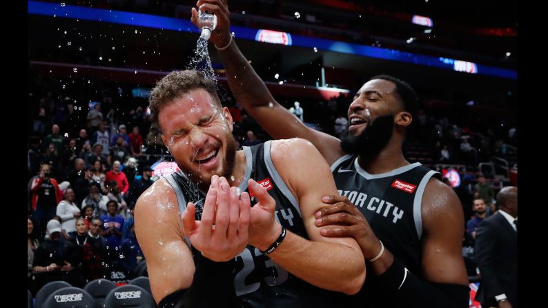 Andre Drummond of the Detroit Pistons pours water onto Blake Griffin after the Pistons defeated the Houston Rockets 116-111 in overtime in an NBA basketball game Friday, November 23 in Detroit.