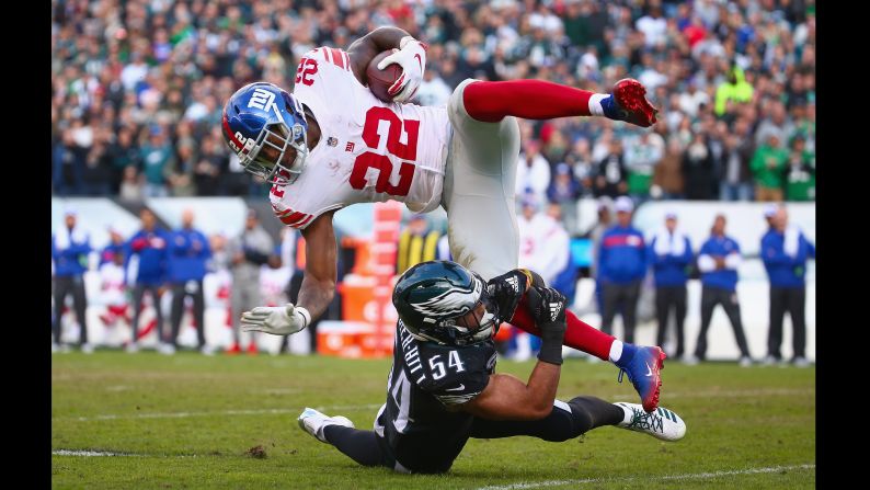 Wayne Gallman of the New York Giants is tackled by Kamu Grugier-Hill of the Philadelphia Eagles on Sunday, November 25 in Philadelphia.