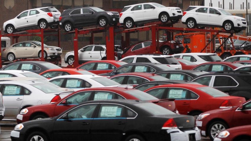 FILE PHOTO: Newly built cars sit in a shipping lot near General Motors Car assembly plant in Oshawa, June 1, 2012. REUTERS/Mark Blinch/File Photo