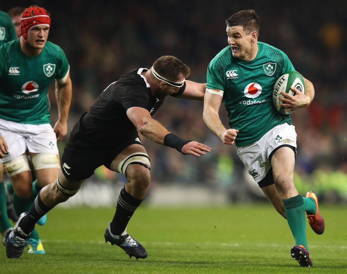 Sexton looks to evade the clutches of New Zealand's Kieran Read in the recent test. 