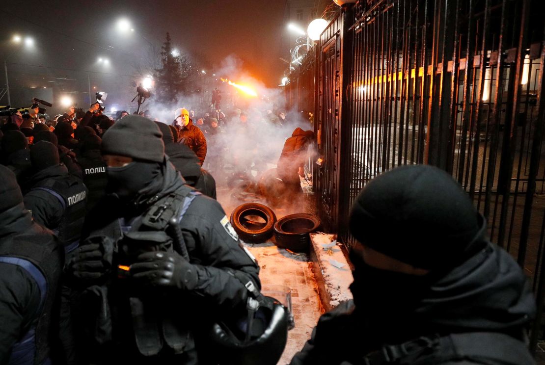 Protesters gather outside the Russian embassy in Kiev on Sunday evening. 