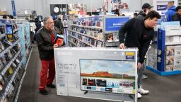 CHICAGO, IL - NOVEMBER 22: Shoppers carry a flat screen TV through a Best Buy Inc. store on November 22, 2018 in Chicago, Illinois. Known as 'Black Friday', the day after Thanksgiving marks the beginning of the holiday shopping season, with many retailers opening their doors on Thursday evening.