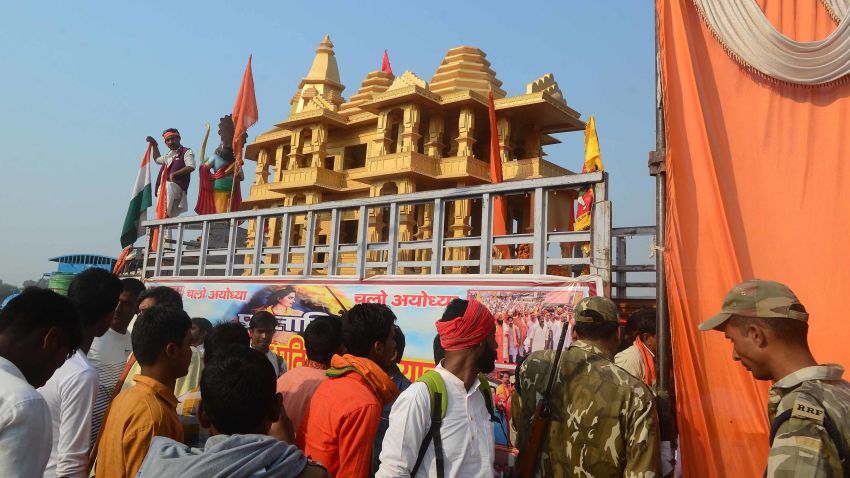 Indian people watch a model of the Ram temple during the 'Dharam Sabha' Hindu congregation held to call for the construction of a grand temple of Lord Rama, in Ayodhya on November 25, 2018. - Hindu groups claim deity Rama was born and a temple existed at the site of a medieval Mosque that was demolished by Hindu mobs in 1992, triggering religious riots that left some 2,000 people dead across India. The more than a century-old dispute over the site has been a frequent  flashpoint between majority Hindus and minority Muslims. (Photo by SANJAY KANOJIA / AFP)        (Photo credit should read SANJAY KANOJIA/AFP/Getty Images)