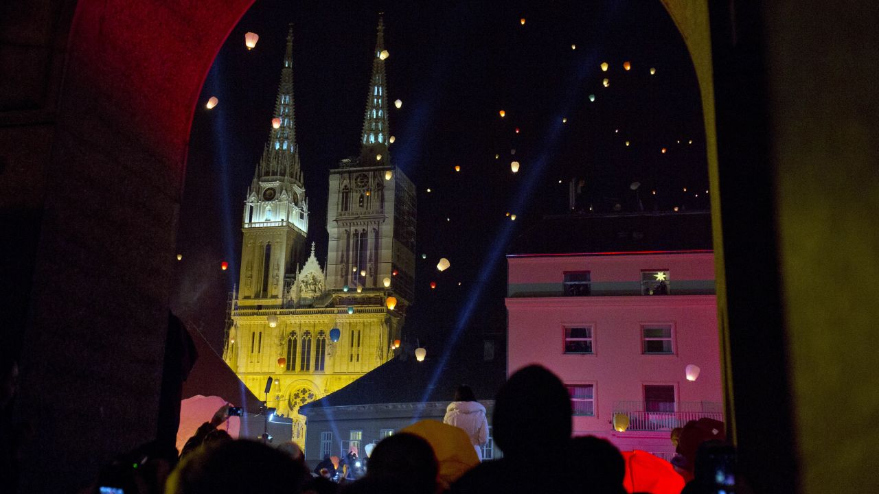 <strong>Advent in Croatia:</strong> Zagreb Cathedral of the Assumption is seen in the background as paper lanterns are released as a part of Christmas festivities in Zagreb, the capital of Croatia.