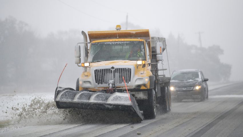 A plow clears snow from Road 438 in Douglas County near Lawrence, Kan., Sunday, Nov. 25, 2018. The area is under a blizzard warning. (AP Photo/Orlin Wagner)