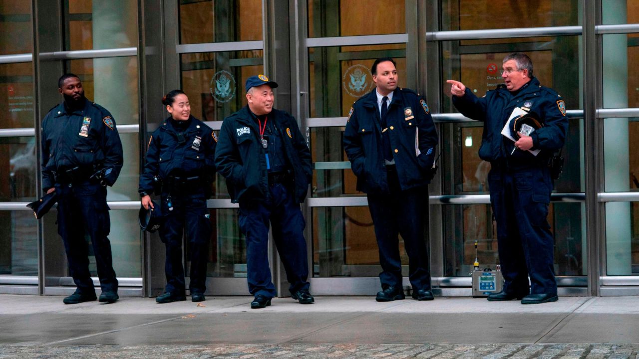 Police patrol near a box used for monitoring multiple threat detection during the start of jury selection for the "El Chapo" trial at Brooklyn Federal Court in New York. 