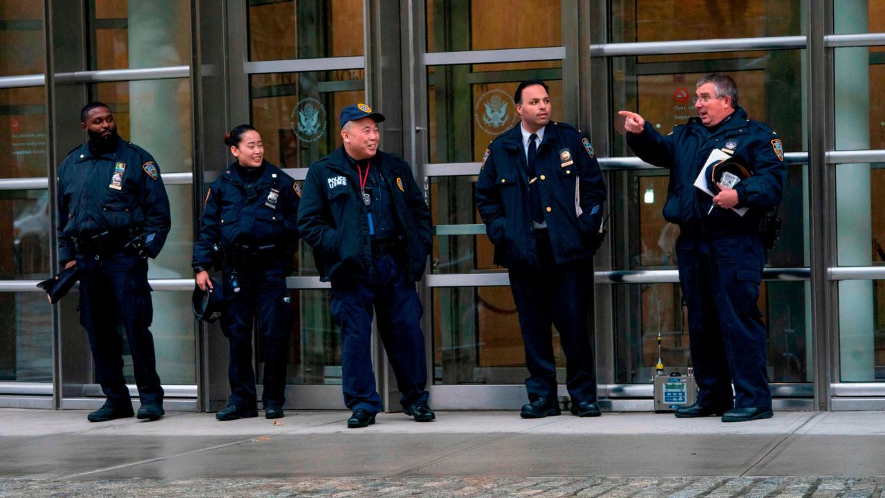 Police patrol near a box used for monitoring multiple threat detection during the start of jury selection for the "El Chapo" trial at Brooklyn Federal Court in New York.