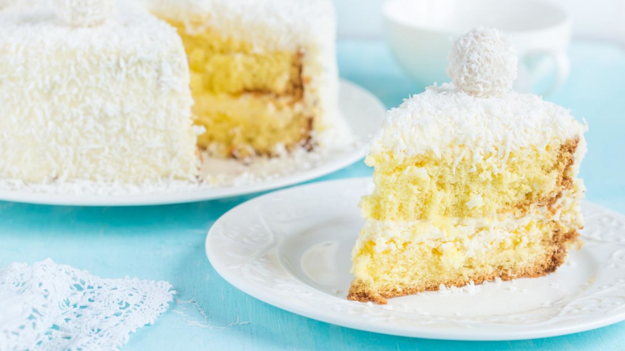 <strong>Coconut Cake, Southern United States:</strong> There are dozens of versions of this cake, but every single one is cloaked in a frothy layer of shredded coconut.