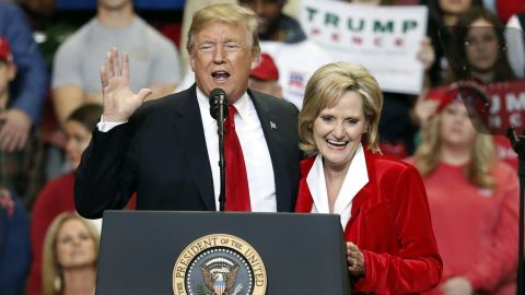 President Donald Trump encourages voters to support Sen. Cindy Hyde-Smith in runoff race against Democrat Mike Espy at a rally Monday, Nov. 26, 2018, in Biloxi, Miss. (AP Photo/Rogelio V. Solis)