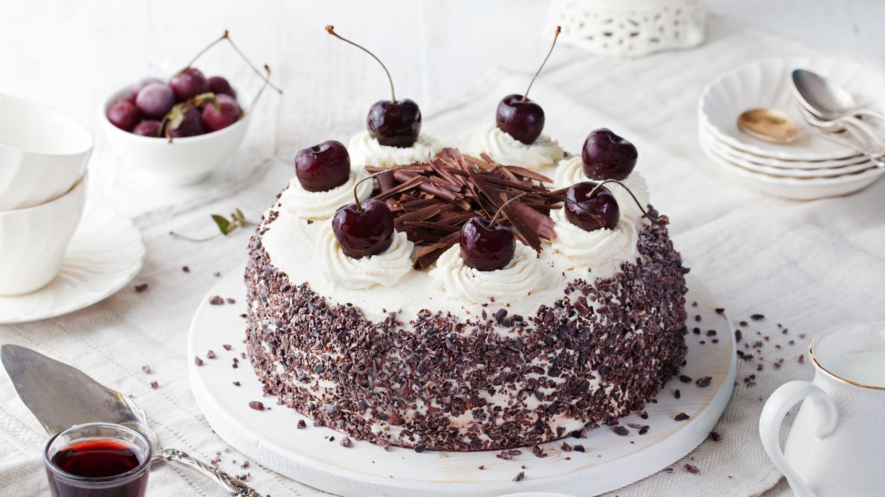 <strong>Black Forest Cake, Germany:</strong> This dark round chocolate cake, doused in a cherry syrup, spiked with sour cherry brandy and layered with whipped cream and fresh cherries, is the star of pastry cases around Germany.
