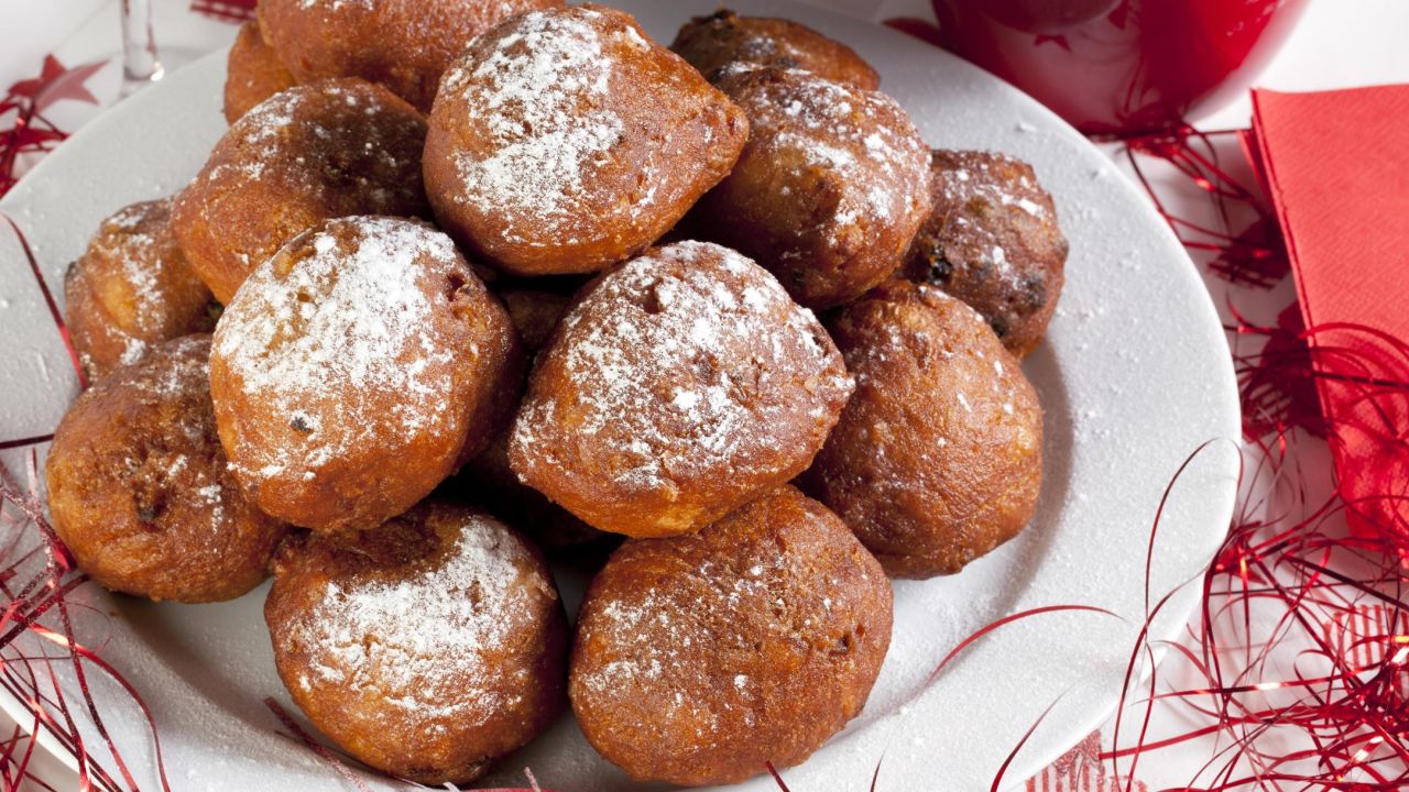 <strong>Oliebollen, Netherlands: </strong>A crunchy, crispy ball of sweetened batter studded with raisins or currants, then dunked in powdered sugar, oliebollen are best eaten hot from street stands called oliebollenkrams.