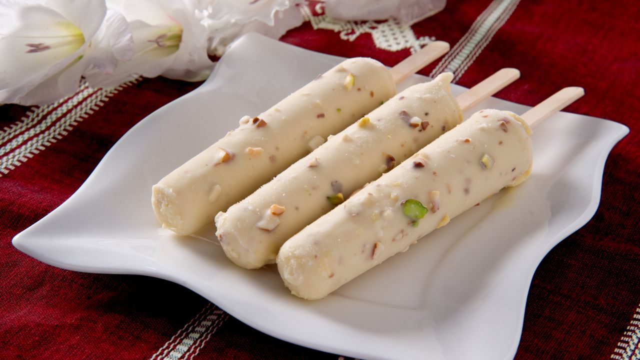 <strong>Kulfi, India:</strong> This frozen dessert can require hours of constant stirring, start by simmering fresh milk over a low flame, a slow reduction that lends a caramel sweetness to the milk's natural sugars. 