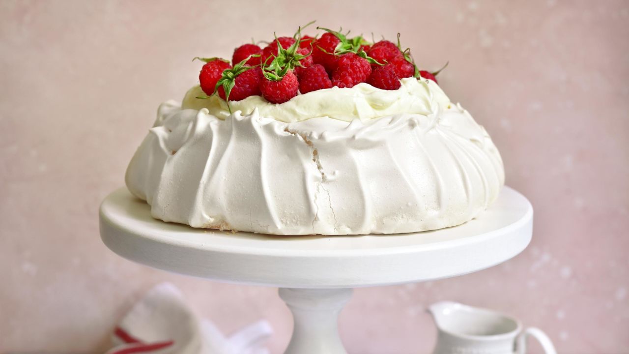 <strong>Pavlova, Australia and New Zealand:</strong> Anna Pavlova, the globe-trotting Russian ballerina that the dessert is named for, visited both countries. Each claims the sweet as their own. A crisp meringue shell leads to a sweetly chewy interior, with whipped cream and tart fruits piled high.