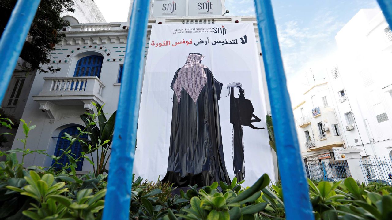 A banner depicting an image of Saudi Crown Prince Mohammed bin Salman holding a chainsaw, is seen near the Union of Tunisian Journalists headquarters in Tunis, Tunisia. 