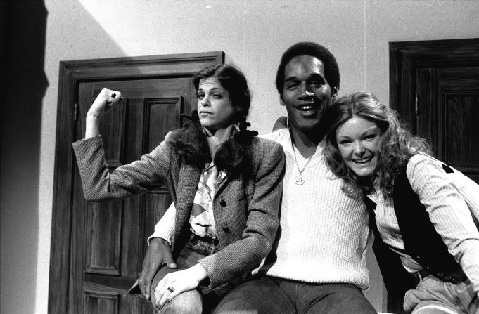 O.J. Simpson -- the second athlete to host "Saturday Night Live" -- posing with Radner and Curtin in 1978 during the show's third season.
