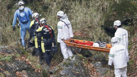 Divers and rescue workers search the Gokase River in Takachiho on November 27, 2018. 