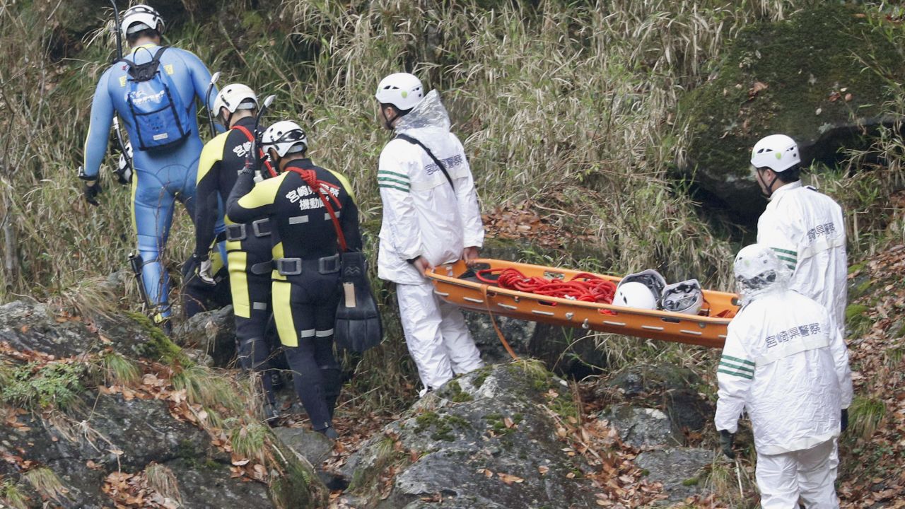 Divers and rescue workers search the Gokase River in Takachiho on November 27, 2018.