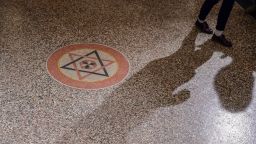 A member of Berlin's Jewish Community walks past the Star of David inside the Synagogue Rykestrasse in Berlin prior to a ceremony on November 9, 2018 to commemorate the 80th anniversary of the Kristallnacht Nazi pogrom. - Germany remembers victims of the Nazi pogrom that heralded the start of the Third Reich's drive to wipe out Jews, at a time when anti-Semitism is resurgent in the West. (Photo by Tobias SCHWARZ / AFP)        (Photo credit should read TOBIAS SCHWARZ/AFP/Getty Images)