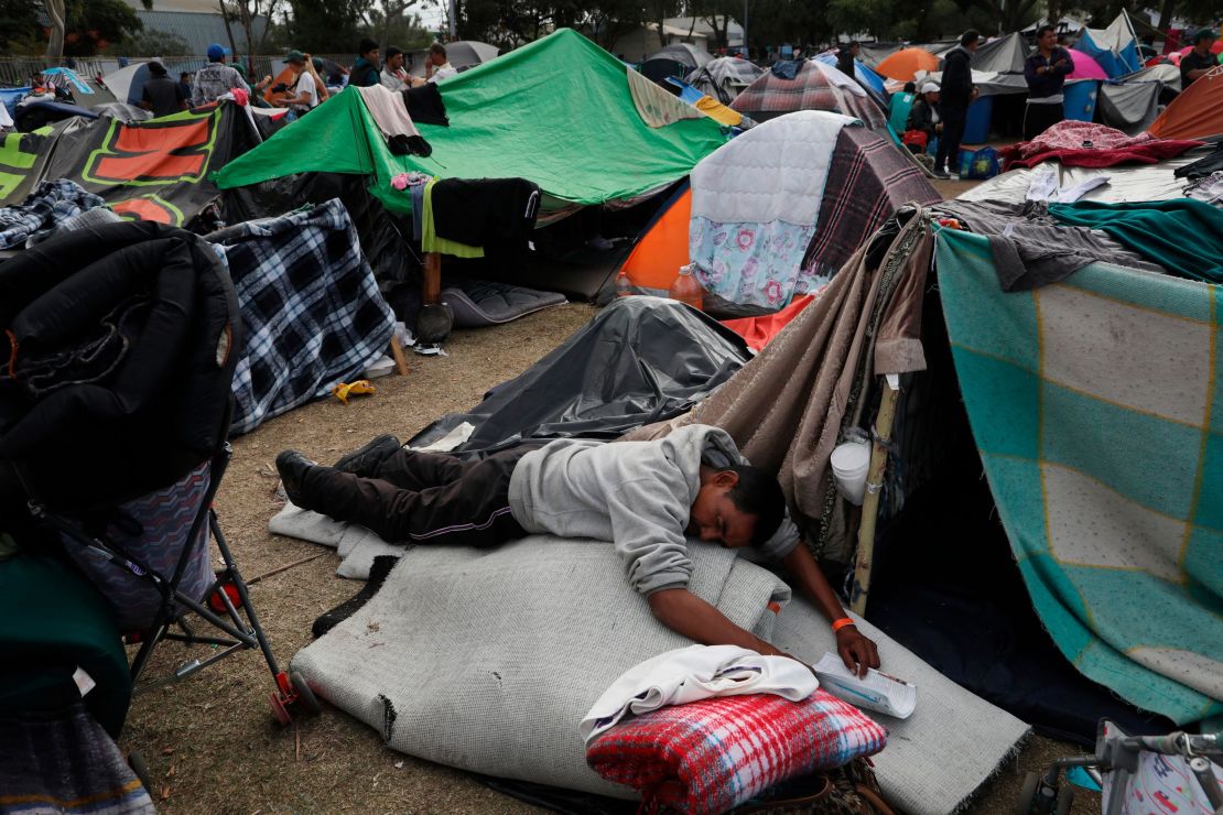 A man naps at the Benito Juarez Sports Complex. 