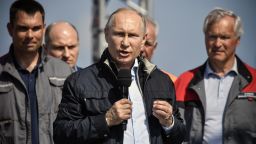 Russian President Vladimir Putin makes a speech during the opening ceremony of the road-and-rail Crimean Bridge over the Kerch Strait on May 15, 2018. - Vladimir Putin inaugurated the 19 kilometres (12 miles) bridge consisting of parallel road and railway sections that link southern Russia to the Crimean peninsula which was annexed from Ukraine in 2014, a highly symbolic project he has personally championed. Built at a cost of 228 billion rubles ($3.69 billion), the new structure connects the southern Krasnodar region with the Crimean city of Kerch, spanning a strait between the Black Sea and the Azov Sea. (Photo by Alexander NEMENOV / POOL / AFP)        (Photo credit should read ALEXANDER NEMENOV/AFP/Getty Images)