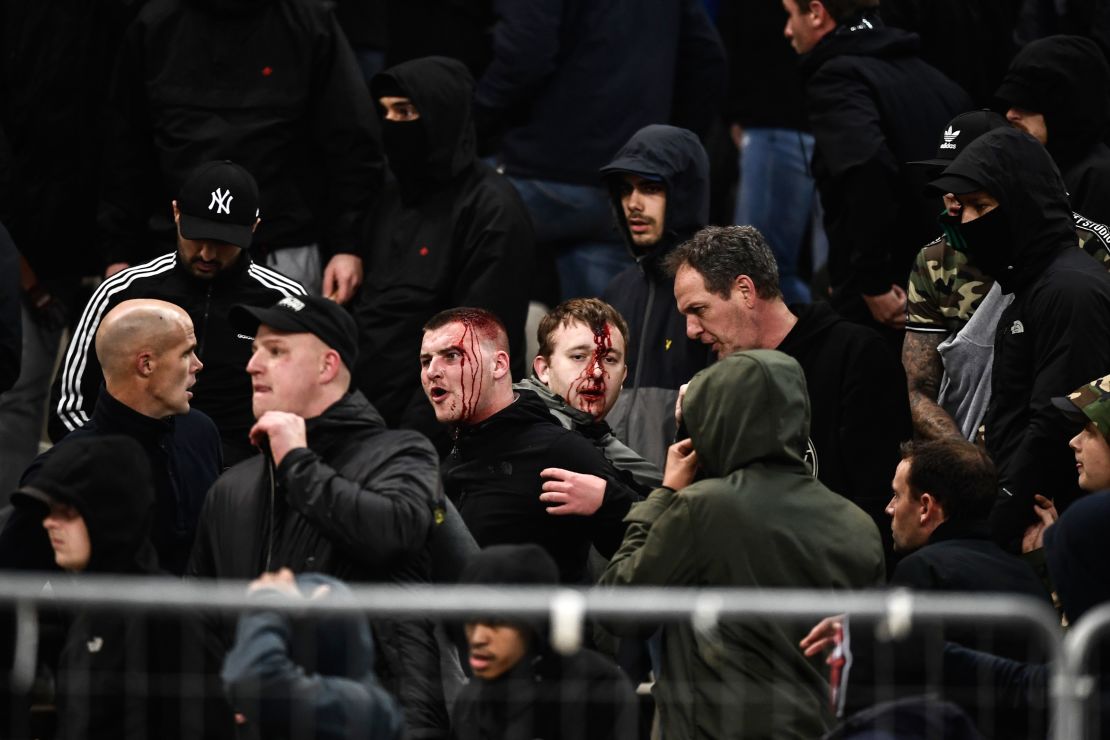 Ajax supporters were left bloodied in clashes before the team's game at AEK Athens in the Champions League. 